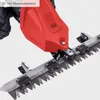 Close-up of a red and silver hedge trimmer with a detailed view of the blades and cutting mechanism. Náhľad obrázku produktu