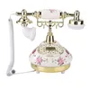 A vintage-style telephone with floral decorations. Náhľad obrázku produktu