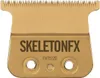 A close-up, isolated shot of a gold-colored hair clipper blade. Náhled obrázku produktu