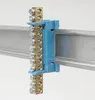 A close-up shot of an electrical terminal block mounted on a DIN rail. Produktbild-Vorschau