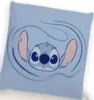 A cartoon drawing of Stitch on a light blue background. Produktbild-Vorschau