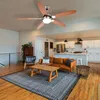 A living room and kitchen area with a ceiling fan. Anteprima dell’immagine prodotto