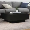 A black coffee table is placed in front of a gray sofa in a living room setting. Anteprima dell’immagine prodotto