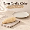 Schwammgurke geschält im Wohnraum auf einer hellen Ablage Produktbild-Vorschau