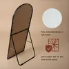 The back of a full-length mirror with a stand, showing protective foil and text descriptions. Produktbild-Vorschau