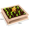 A toy garden bed with a farmer figurine and toy plants. Voir les images du produit