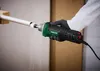 A person wearing gloves is using a PARKSIDE® Geradschleifer »PGS 500 C2« to cut a white pipe. Produktbild-Vorschau