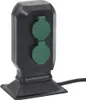 A black and green outdoor electrical outlet with two sockets. Anteprima dell’immagine prodotto