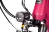 Close-up of a bicycle's front light and part of the frame. Produktbild-Vorschau
