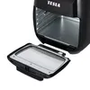 A black Tesla air fryer with its door open, showing the interior. Podgląd zdjęcia produktu
