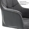 A close-up view of the armrest and backrest of a dark gray upholstered chair. Produktbild-Vorschau