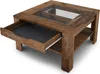A square coffee table with a glass top and a pull-out drawer is shown from a diagonal angle. Náhled obrázku produktu