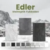 Three large samples of vinyl flooring with stone-look textures are displayed on a white platform in front of a mountainous landscape. Below them, a row of smaller samples shows various color and texture options. Produktbild-Vorschau