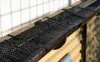 A close-up view of a gutter guard installed on a house gutter. Podgląd zdjęcia produktu