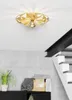 A modern interior with a ceiling light fixture above a staircase and a shelf with plants and decor. Produktbild-Vorschau