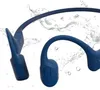 A pair of blue bone conduction headphones with water splashes in the background. Produktbild-Vorschau