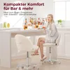 A woman sits at a bar-style table with drinks, while two fluffy white chairs are placed in front of it. Náhled obrázku produktu
