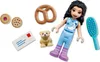 A LEGO Friends advent calendar figure and accessories are displayed on a white background. Náhled obrázku produktu
