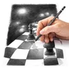 A hand is drawing a chess scene on a piece of paper with a pencil. Anteprima dell’immagine prodotto