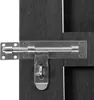 A close-up of a metal gate latch on a dark wooden gate. Náhled obrázku produktu