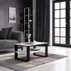 A modern living room with a couch, coffee table, and bookshelf. Produktbild-Vorschau