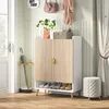 An entryway with a shoe cabinet, umbrella stand, and stool. Produktbild-Vorschau