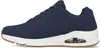 A side view of a blue Skechers Uno sneaker with a white sole and brown outsole. Náhled obrázku produktu