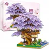 A model of a treehouse with purple blossoms, displayed with its packaging. Náhľad obrázku produktu