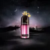 A perfume bottle is displayed in a desert landscape at night under a starry sky. Náhled obrázku produktu