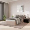 A bedroom scene with a bed, nightstand, and plant. Náhled obrázku produktu