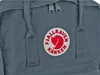 A close-up view of a grey Fjällräven Kanken backpack, showing the brand logo. Náhled obrázku produktu