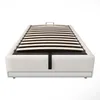 A white upholstered bed frame with a slatted base, shown from the front. Voir les images du produit