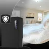 A dehumidifier is shown in a bedroom setting, with stylized bubbles representing air purification or moisture removal. Voir les images du produit
