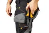 A person wearing work pants with tools in a pocket. Náhled obrázku produktu