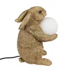A gold-colored rabbit figurine holding a white orb, likely a lamp. Náhled obrázku produktu