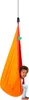 A child sits in a colorful hanging chair. Produktbild-Vorschau