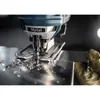 A close-up shot of a jigsaw cutting through metal, with metal shavings scattered around. Voir les images du produit