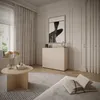 A modern living room with a sideboard, coffee table, rug, and artwork. Anteprima dell’immagine prodotto