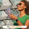 A woman is holding a transparent phone case in front of a blurred urban background. Produktbild-Vorschau
