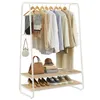 A white garment rack with various clothing items and accessories on display, along with shoes on the bottom shelf. Voir les images du produit