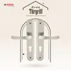 A pair of silver door handles are displayed against a patterned background, with text and a logo above. Produktbild-Vorschau