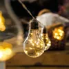 A close-up shot of a string of LED light bulbs, with a blurred background of a basket and other lights. Produktbild-Vorschau