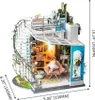 A miniature dollhouse with a modern design, featuring a spiral staircase, balcony, and interior rooms. Anteprima dell’immagine prodotto