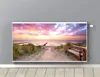 A radiator cover with a beach sunset scene printed on it, mounted on a gray wall above a wooden floor. Anteprima dell’immagine prodotto