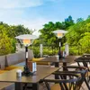 An outdoor seating area with tables and chairs, featuring two patio heaters. Náhľad obrázku produktu