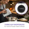 A woman is using a white hand mixer to mix ingredients in a bowl. Podgląd zdjęcia produktu