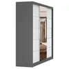 A three-quarter view of a modern sliding door wardrobe with a gray frame and white panels, featuring a mirrored section reflecting a bedroom interior. Produktbild-Vorschau