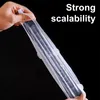 A hand is stretching a clear silicone lid over a dark object, with text indicating 'Strong scalability'. Produktbild-Vorschau