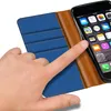 A hand is shown interacting with a smartphone case that is open, revealing the phone screen. Produktbild-Vorschau