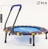 A small trampoline with a handle and colorful pattern on the mat, shown on a white background with measurement indicators. Anteprima dell’immagine prodotto